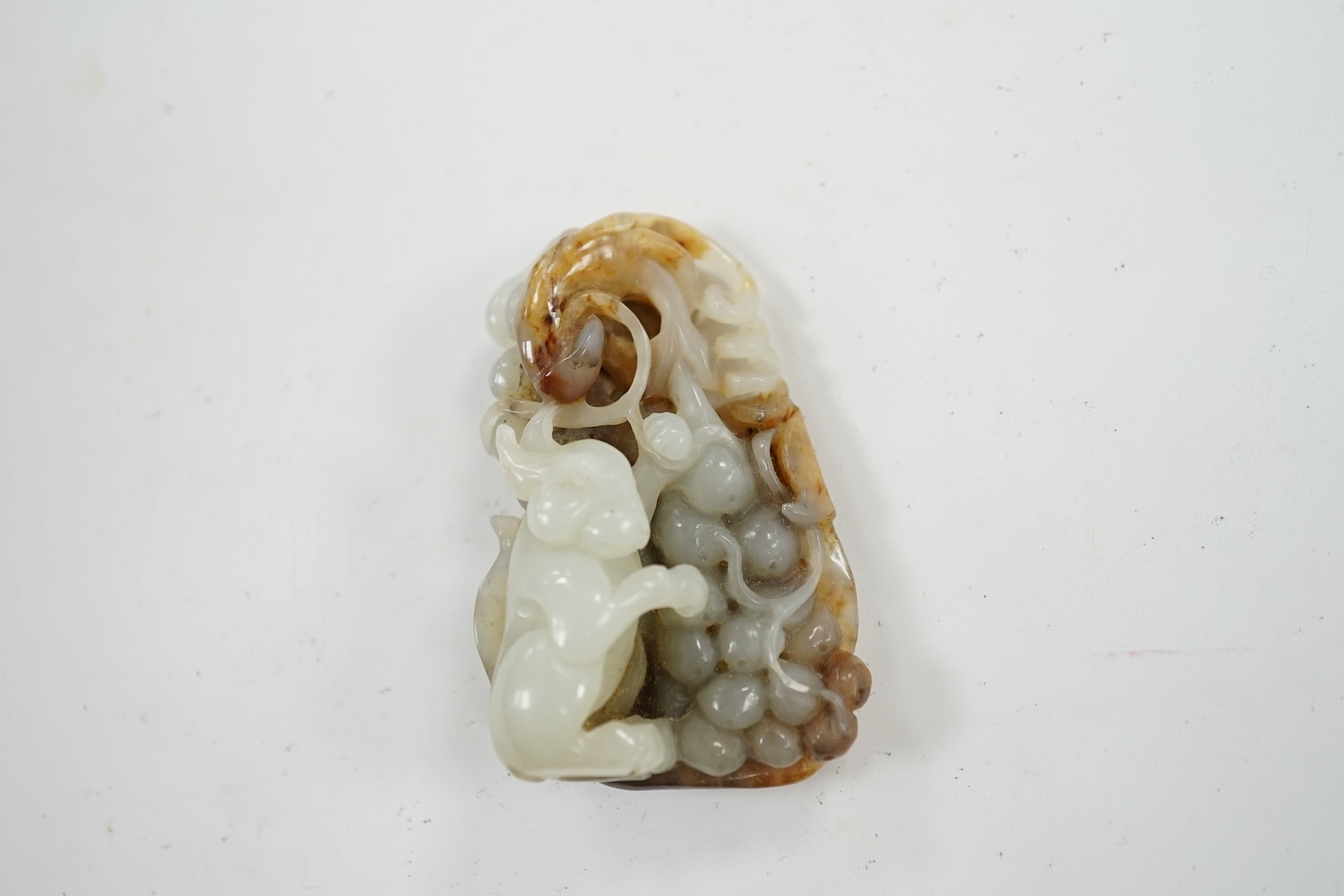 A Chinese russet jade carving of an animal, 6cm high. Condition - good